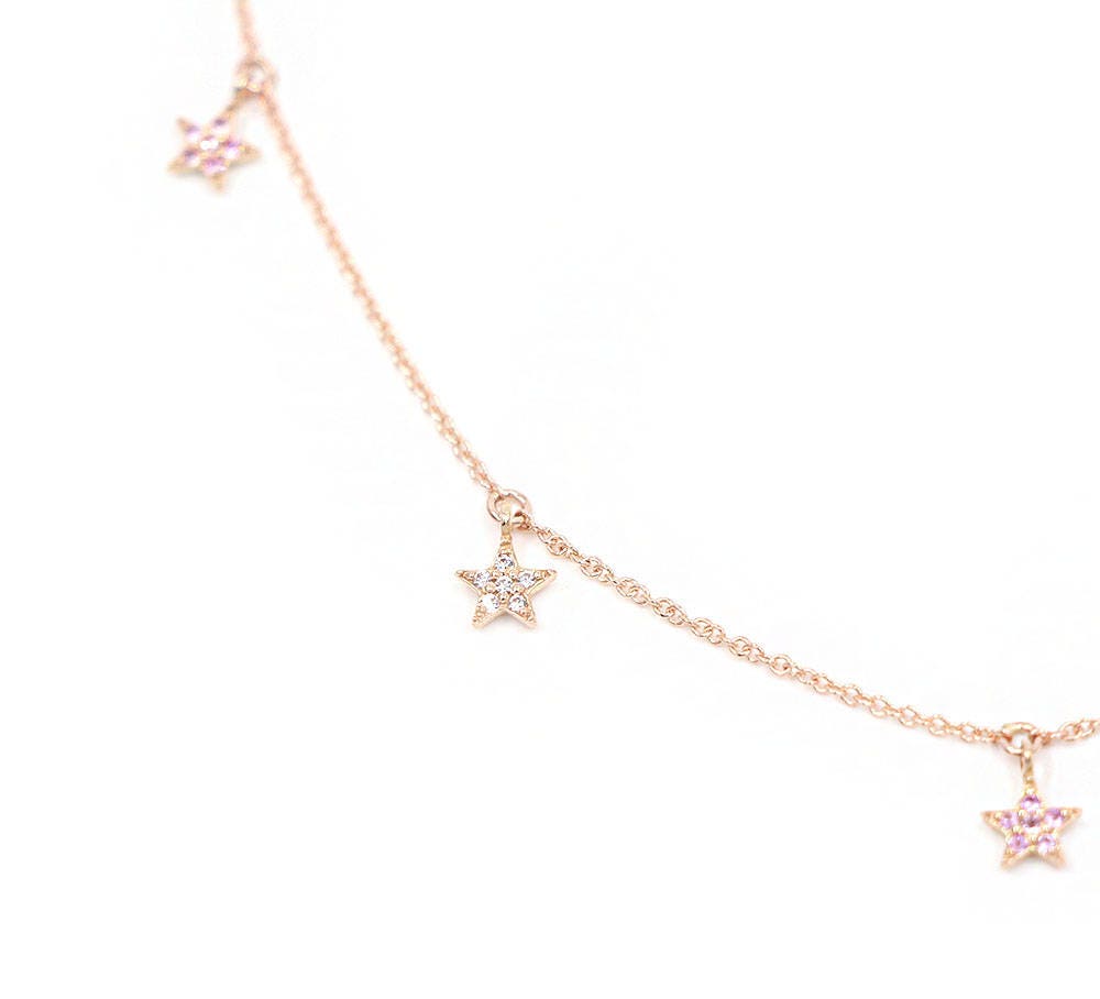 Picture of star charm necklaces with diamonds and