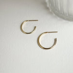 Load image into Gallery viewer, Picture of open hoops solid gold earrings gold hoop
