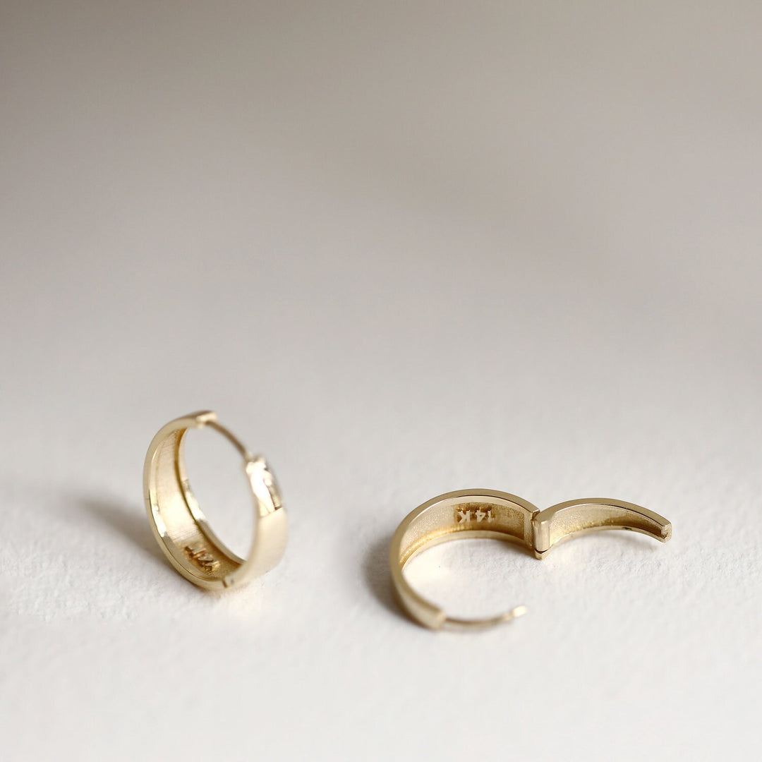 Picture of asymmetrical hoops solid gold earrings