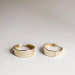 Load image into Gallery viewer, Picture of asymmetrical hoops solid gold earrings
