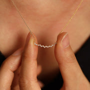 Picture of curved cluster diamond necklace diamond