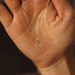 Load image into Gallery viewer, Picture of 14k gold wishbone necklace 14k gold
