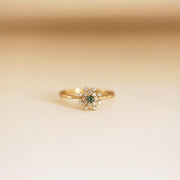 Picture of diamond cluster ring green sapphire
