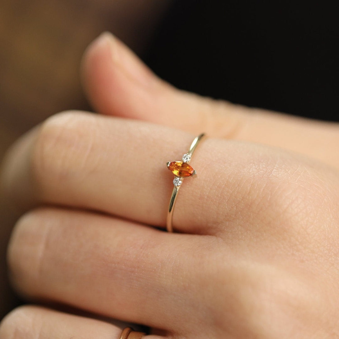 Picture of orange sapphire marquise diamond ring