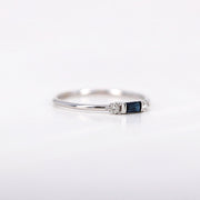 Picture of baguette cut blue sapphire ring with two