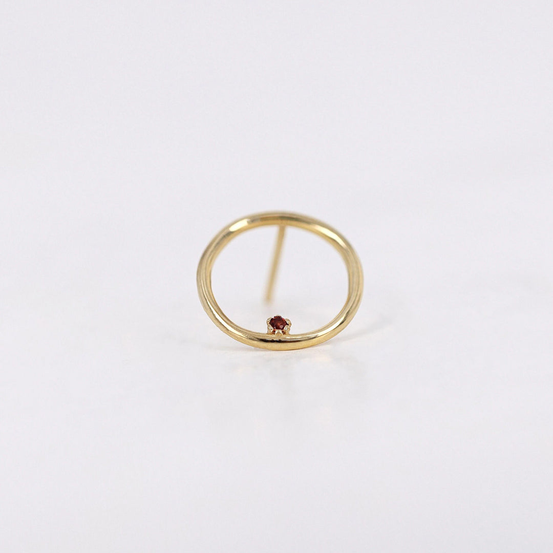 Picture of open circle karma with garnet gemstone