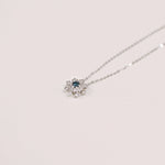 Load image into Gallery viewer, Picture of blue diamond cluster snowflake necklace
