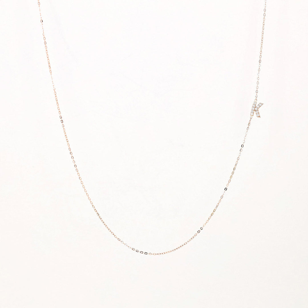 Picture of sideways diamond initial necklace