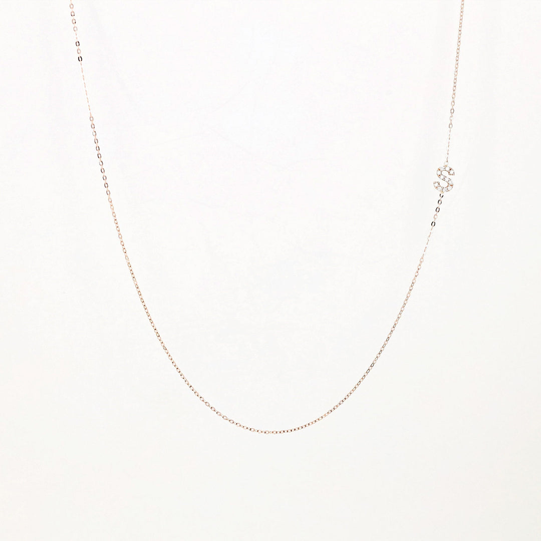 Picture of sideways diamond initial necklace