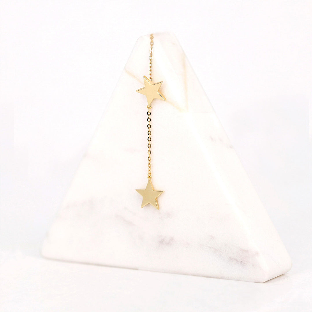 Picture of star earring two stars drop earring 14k