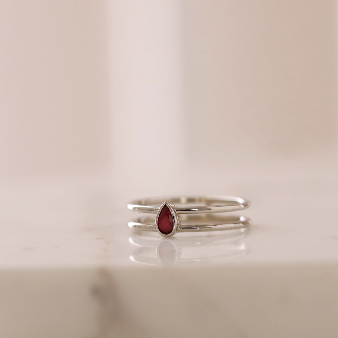 Picture of pear shape ruby solitaire ring double