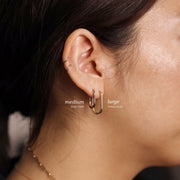 Picture of large round rectangular huggie earrings