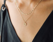 Picture of 14k initial coin necklace coin necklace